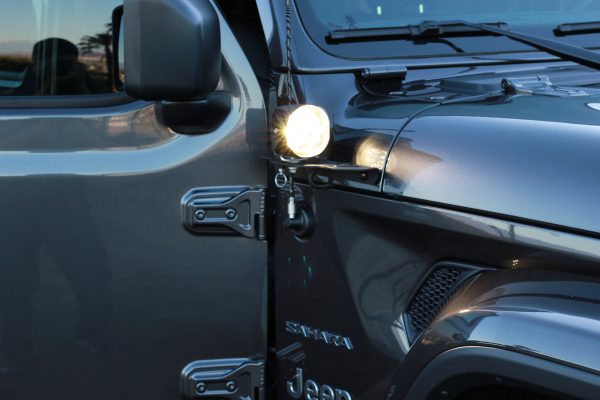 Front view of JL 180 Light Mount installed on jeep with light turned on