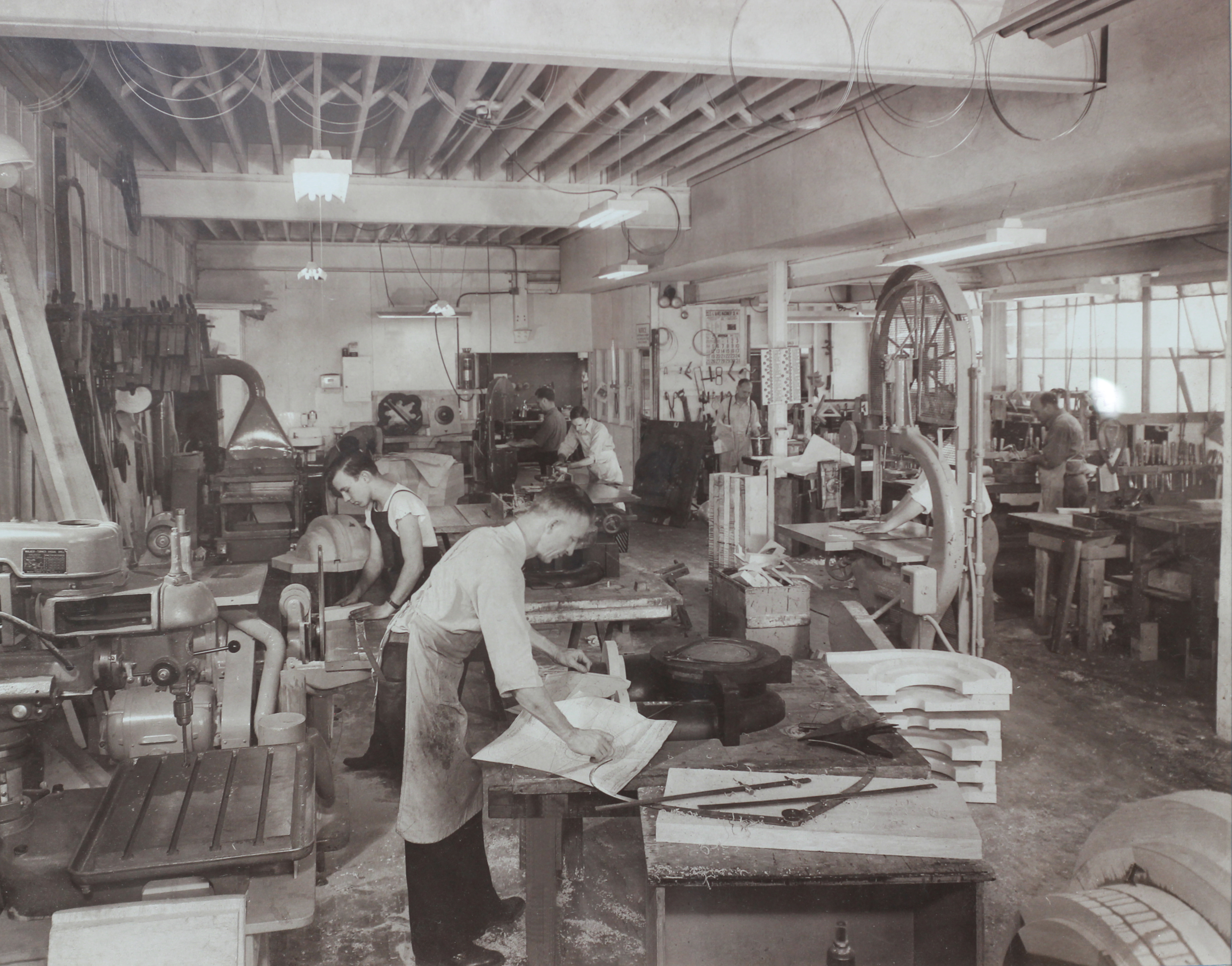 Old photo of workers in a pattern shop