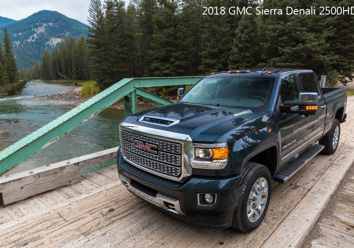 2018 GMC Sierra Denali Truck on bridge next to the woods