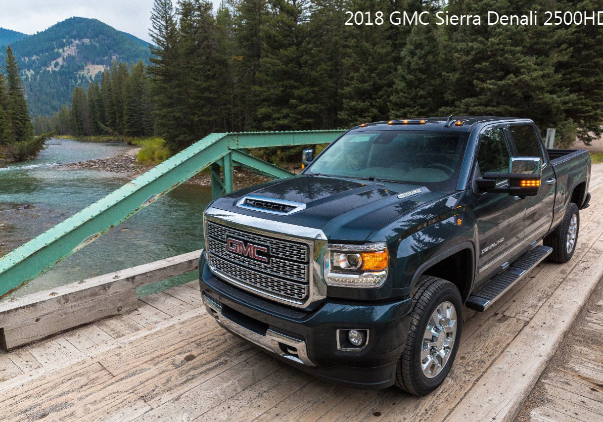 2018 GMC Sierra Denali Truck on bridge next to the woods